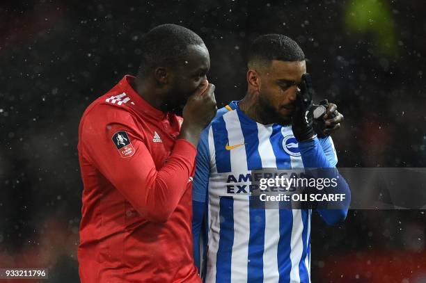 Manchester United's Belgian striker Romelu Lukaku greets Brighton's Dutch striker Jurgen Locadia after the final whistle during the English FA Cup...