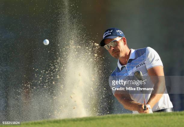 Henrik Stenson of Sweden plays a shot from a bunker on the 17th hole during the third round at the Arnold Palmer Invitational Presented By MasterCard...