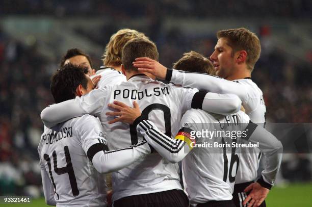 Lukas Podolski of Germany and his team mates Piotr Trochowski, Stefan Kiessling, Philipp Lahm and Thomas Hitzlsperger celebrate the first goal during...