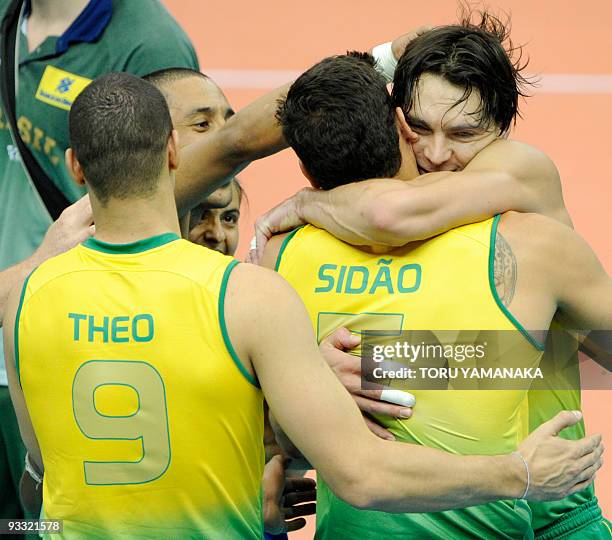 Brazilian captain Gilberto Godoy Filho celebrates with his teammates Sidnei dos Santos Jr. And Theo Lopes just after their victory over Japan in the...