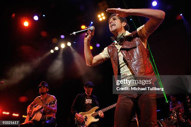 Guitarist Dave Navarro, bassist Chris Chaney and singer Perry Farrell perform at the "LAYN Rocks" benefit concert for the Los Angeles Youth Network,...