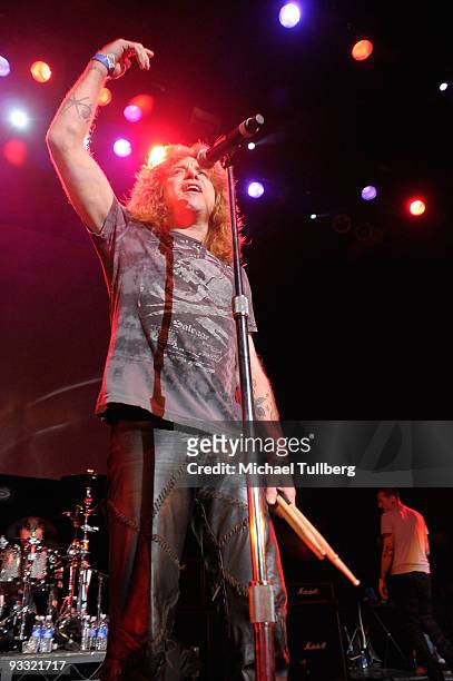 Former Guns N' Roses drummer Steven Adler acknowledges the crowd at the "LAYN Rocks" benefit concert for the Los Angeles Youth Network, held at the...