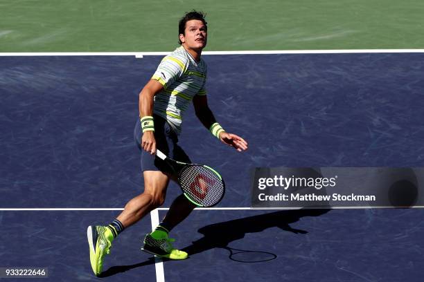 Milos Roanic of Canada fades back for a shot while playing Juan Martin Del Potro of Argentina during the semifinal match on Day 13 of the BNP Paribas...