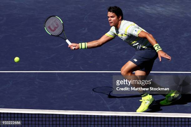 Milos Roanic of Canada returns a shot to Juan Martin Del Potro of Argentina during the semifinal match on Day 13 of the BNP Paribas Open at the...