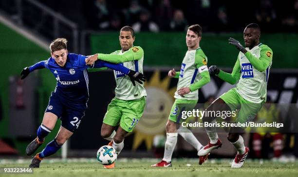 Bastian Oczipka of FC Schalke 04 in action with Daniel Didavi of VfL Wolfsburg during the Bundesliga match between VfL Wolfsburg and FC Schalke 04 at...