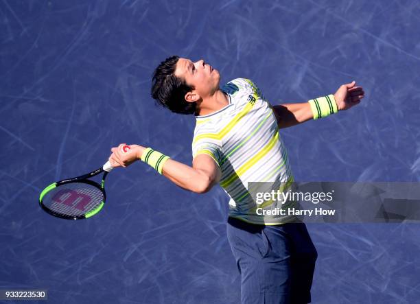 Milos Raonic of Canada serves in his semifinal loss to Juan Martin Del Potro of Argentina during the BNP Paribas Open at the Indian Wells Tennis...