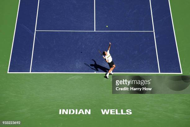 Roger Federer of Switzerland serves in his semifinal win over Borna Coric of Croatia during the BNP Paribas Open at the Indian Wells Tennis Garden on...