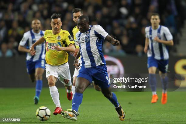 Boavista's Portuguese midfielder Fabio Espinho with Porto's Cameroonian forward Vincent Aboubakar during the Premier League 2017/18 match between FC...