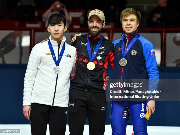 Hyo Jun Lim of Korea , Charles Hamelin of Canada and Semen Elistratov of Russia pose with their medals after completing the men's 1500 meter Final...