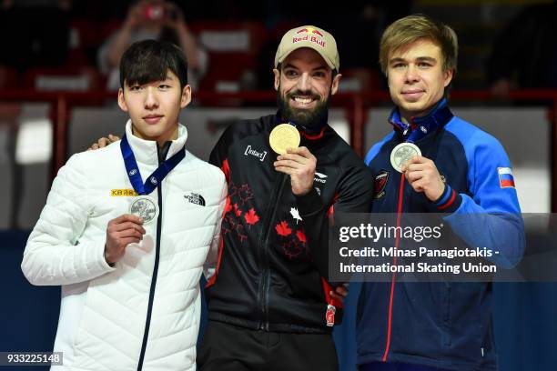 Hyo Jun Lim of Korea , Charles Hamelin of Canada and Semen Elistratov of Russia pose with their medals after completing the men's 1500 meter Final...