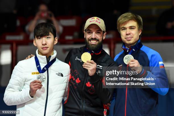 Hyo Jun Lim of Korea , Charles Hamelin of Canada and Semen Elistratov of Russia pose with their medals after completing the men's 1500 meter Final...