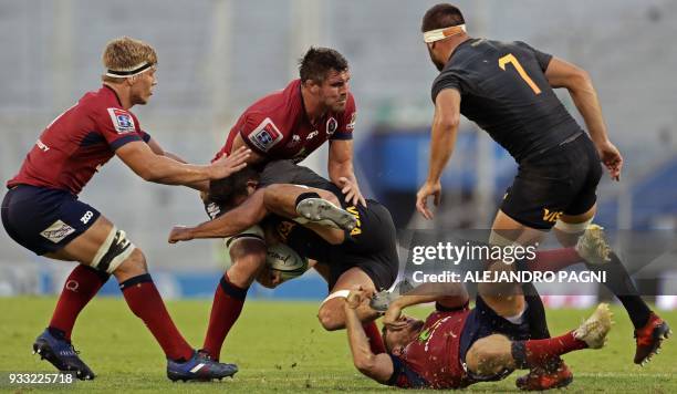 Australia's Reds lock Kane Douglas vies for the ball with Argentina's Jaguares flanker Pablo Matera during their Super Rugby match at the Jose...