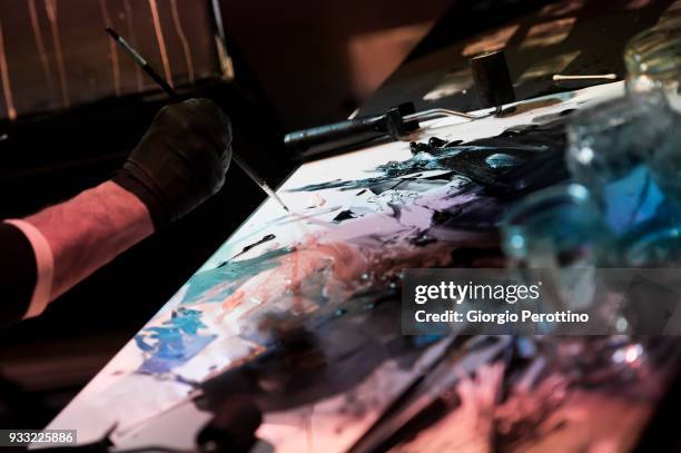 Painter Daniele Galliano performs live painting during the show called 'Understatements Arto Lindsay ft. Ikue Mori & Stefan Brunner @OGR' on March...
