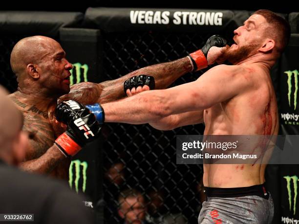 Jimi Manuwa punches Jan Blachowicz of Poland in their light heavyweight bout inside The O2 Arena on March 17, 2018 in London, England.