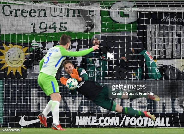 Ralf Fhrmann of Schalke saves the penalty shot by Paul Verhaegh of Wolfsburg during the Bundesliga match between VfL Wolfsburg and FC Schalke 04 at...