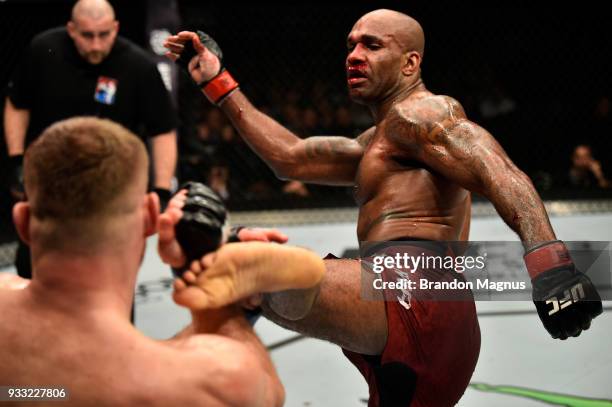 Jimi Manuwa kicks Jan Blachowicz of Poland in their light heavyweight bout inside The O2 Arena on March 17, 2018 in London, England.