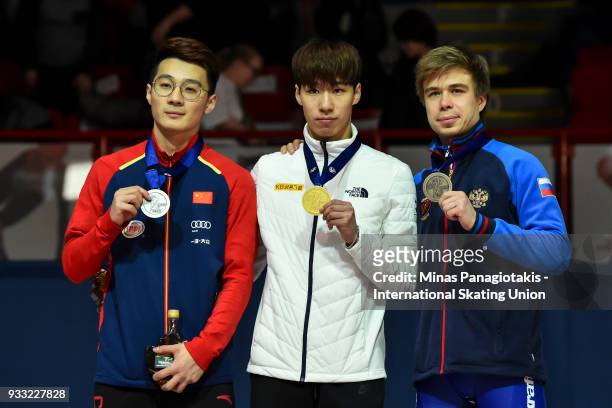 Ziwei Ren of China , Dae Heon Hwang of Korea and Semen Elistratov of Russia hold up their medals after completing the men's 500 meter Final during...