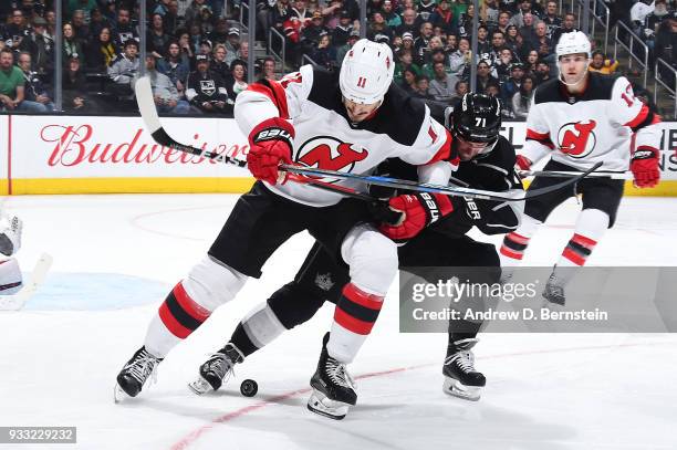 Brian Boyle of the New Jersey Devils battles for the puck against Torrey Mitchell of the Los Angeles Kings at STAPLES Center on March 17, 2018 in Los...
