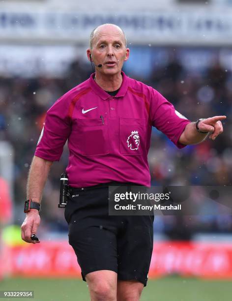 Referee Mike Dean during the Premier League match between Huddersfield Town and Crystal Palace at John Smith's Stadium on March 17, 2018 in...