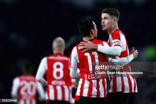 Marco van Ginkel of PSV celebrates scoring his teams first goal of the game with team mate Hirving Lozano during the Dutch Eredivisie match between...
