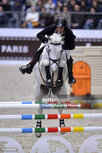Andrew Kocher of the United States of America on Navalo De Poheton competes during the Saut Hermes at Le Grand Palais on March 17, 2018 in Paris,...