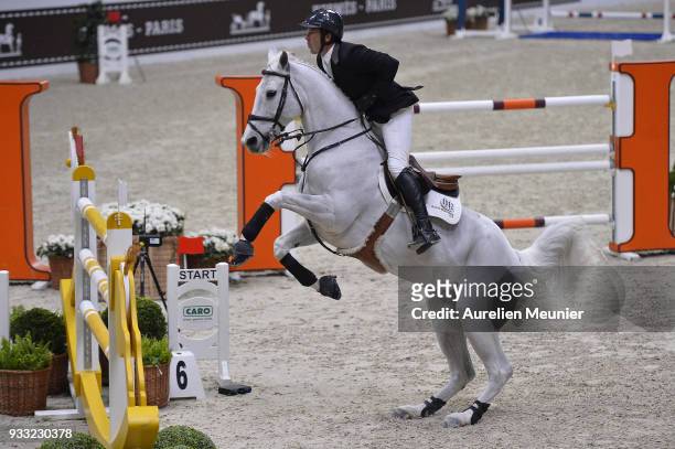 Andrew Kocher of the United States of America on Navalo De Poheton competes during the Saut Hermes at Le Grand Palais on March 17, 2018 in Paris,...