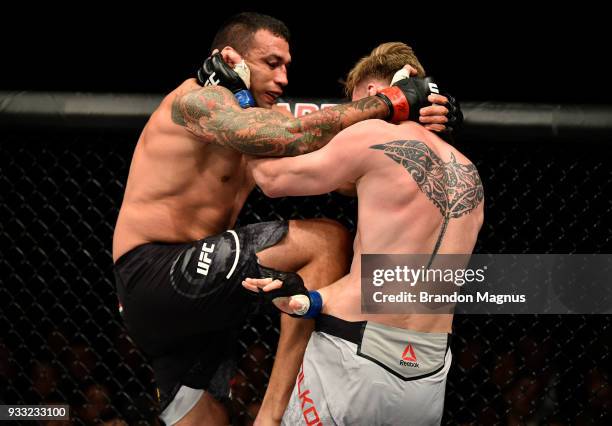 Fabricio Werdum of Brazil lands a knee to the body of Alexander Volkov of Russia in their heavyweight bout inside The O2 Arena on March 17, 2018 in...