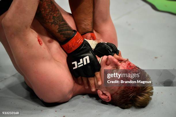 Fabricio Werdum of Brazil applies pressure to Alexander Volkov of Russia in their heavyweight bout inside The O2 Arena on March 17, 2018 in London,...