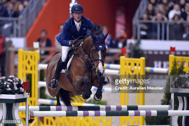 Daniel Deusser of Germany on Equita Van T Zorgvliet competes during the Saut Hermes at Le Grand Palais on March 17, 2018 in Paris, France.