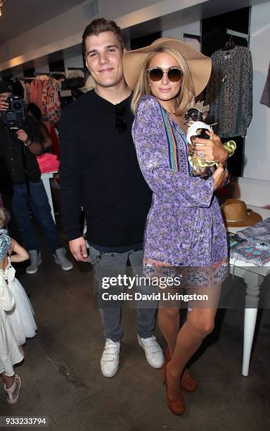 Actor Chris Zylka and businesswoman Paris Hilton attend the Nicky Hilton x Tolani launch at KitRoss on March 17, 2018 in Los Angeles, California.