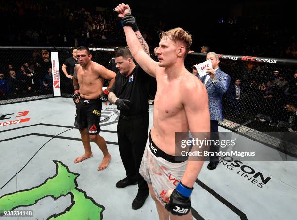 Alexander Volkov of Russia celebrates after defeating Fabricio Werdum of Brazil in their heavyweight bout inside The O2 Arena on March 17, 2018 in...