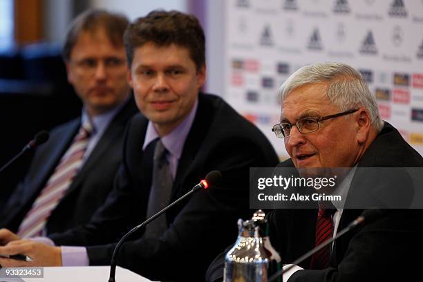 Legal advisor Joerg Englisch, Carsten Koerl of Sportradar AG, and DFB President Theo Zwanziger attend a press conference on the rising manipulation...