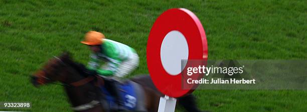 Jason Maguire and King ar Aghaidh pass the winning post to land The Halcyon Gallery Handicap Hurdle Race run at Kempton Park Racecourse on November...