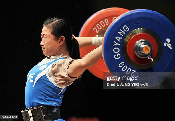 Chen Wei-Ling of Taiwan misses a lift during the women's 48Kg category of the World Weightlifting Championships in Goyang, north of Seoul, on...