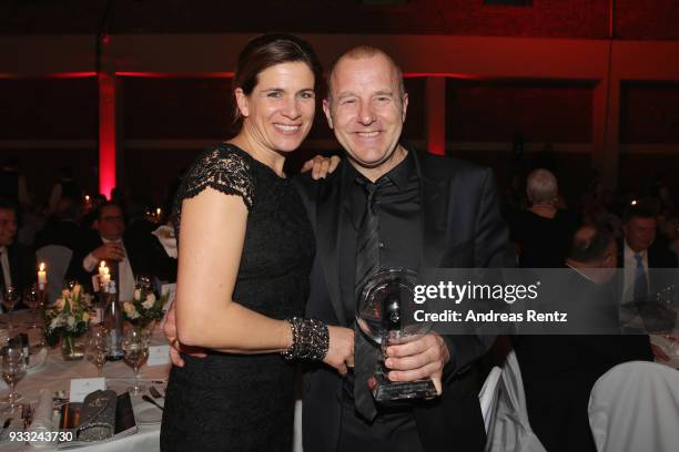 Heino Ferch and his wife Marie-Jeanette Ferch pose with his award during the Steiger Award at Zeche Hansemann on March 17, 2018 in Dortmund, Germany.