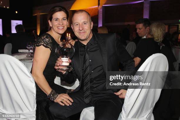 Heino Ferch and his wife Marie-Jeanette Ferch pose with his award during the Steiger Award at Zeche Hansemann on March 17, 2018 in Dortmund, Germany.