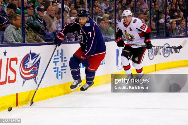 Jack Johnson of the Columbus Blue Jackets skates the puck away from Matt Duchene of the Ottawa Senators during the first period on March 17, 2018 at...