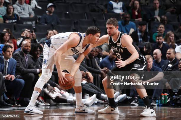 Doug McDermott of the Dallas Mavericks handles the ball against Joe Harris of the Brooklyn Netson March 17, 2018 at Barclays Center in Brooklyn, New...