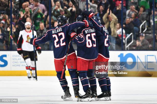 Markus Nutivaara of the Columbus Blue Jackets celebrates his second period power play goal against the Ottawa Senators with Sonny Milano of the...