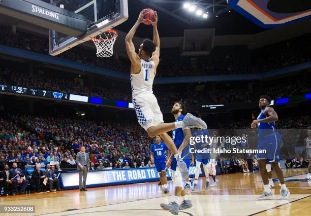 Kentucky's Sacha Killeya-Jones hammers down two points off an alley-oop pass behind Buffalo's defense in the second round of the NCAA Tournament West...
