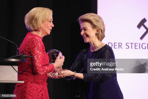 German Defense Minister Ursula von der Leyen hands over the award to Liz Mohn during the Steiger Award at Zeche Hansemann on March 17, 2018 in...