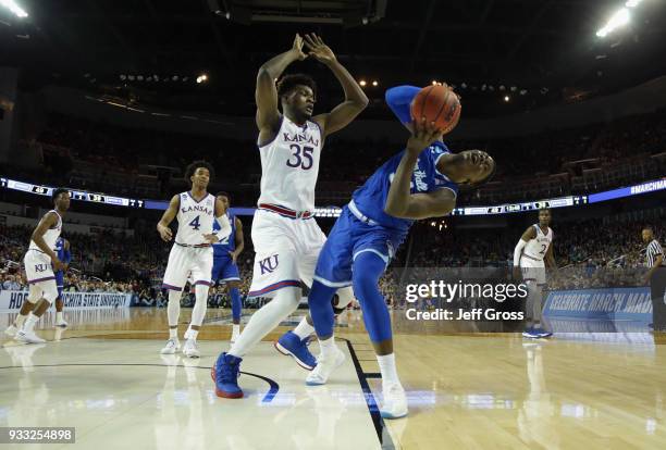 Angel Delgado of the Seton Hall Pirates reacts against Udoka Azubuike of the Kansas Jayhawks in the second half during the second round of the 2018...