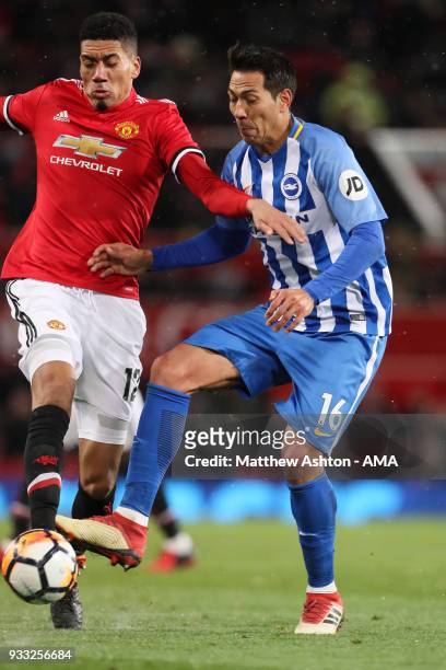 Chris Smalling of Manchester United and Leonardo Ulloa of Brighton & Hove Albion during the FA Cup Quarter Final match between Manchester United and...