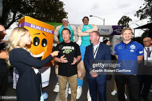 Arnold Schwarzenegger speaks to the media as he prepares to start the Run for the Kids charity run as part of the Arnold Sports Festival Australia at...