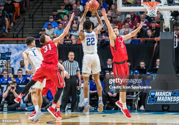 Peyton Aldridge of the Davidson Wildcats goes up in front of G Shai Gilgeous-Alexander of the Kentucky Wildcats during the NCAA Division I Men's...