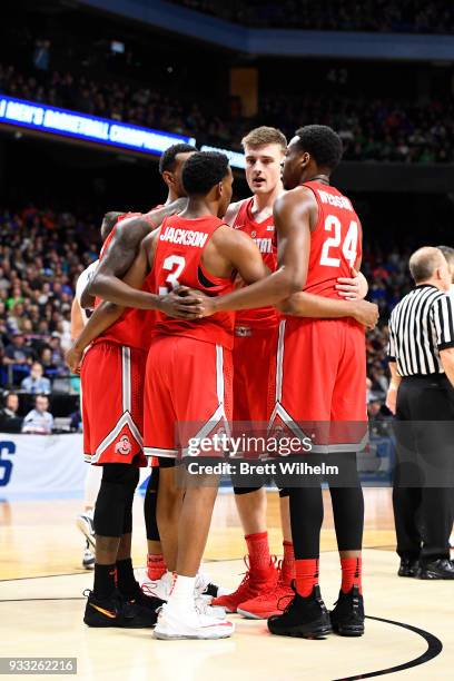 Jackson and Andre Wesson of the Ohio State Buckeyes form a huddle with teammates on court during the first half of the game against the Gonzaga...