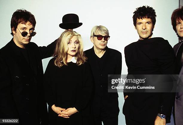 Posed group portrait of American band Blondie circa 1997. Left to right keyboard player Jimmy Destri, singer Debbie Harry, guitarist Chris Stein and...