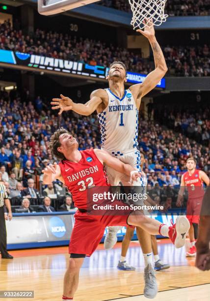 Sacha Killeya-Jones of the Kentucky Wildcats goes up for a rebound over G Rusty Reigel of the Davidson Wildcats during the NCAA Division I Men's...