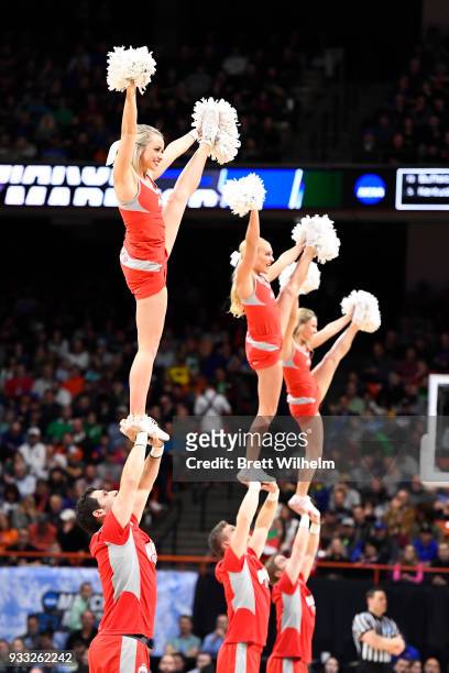 The Ohio State cheerleaders on court during a timeout in the first half of the game against the Gonzaga Bulldogs in the second round of the 2018 NCAA...
