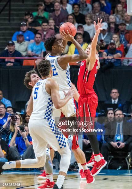 Kellan Grady of the Davidson Wildcats tries to block a pass by G Shai Gilgeous-Alexander of the Kentucky Wildcats during the NCAA Division I Men's...